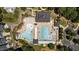 Aerial view shows community pool with swimming areas, lounge chairs, and various amenities at 3306 Storybook Ln, Raleigh, NC 27614