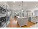 Spacious kitchen featuring an island, stainless steel appliances, and a dining area with lots of natural light at 3306 Storybook Ln, Raleigh, NC 27614