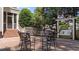 Cozy outdoor seating area with a charming porch swing and well-maintained brick pavers at 3306 Storybook Ln, Raleigh, NC 27614