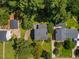 An aerial view showcasing the property, its landscaping, and surrounding neighborhood at 3317 Harden Rd, Raleigh, NC 27607