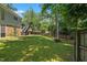 Spacious backyard, deck, and brick accents enhance the outdoor living experience at 3317 Harden Rd, Raleigh, NC 27607