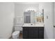 Bathroom with a vanity, mirror, and toilet showcasing modern fixtures at 3317 Harden Rd, Raleigh, NC 27607