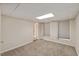 A finished room with neutral walls, carpet, and two windows at 3317 Harden Rd, Raleigh, NC 27607