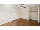 Bedroom with a closet, ceiling fan, and hardwood floors showcases style at 3317 Harden Rd, Raleigh, NC 27607