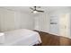 Spacious bedroom with hardwood floors, ceiling fan, and ample closet space at 3317 Harden Rd, Raleigh, NC 27607