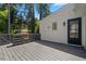 View of deck overlooking a wooded area, accessible via a door at 3317 Harden Rd, Raleigh, NC 27607