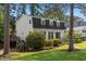 Charming two-story home with lush landscaping and a well-manicured lawn at 3317 Harden Rd, Raleigh, NC 27607