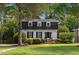 Charming two-story home features a landscaped yard and classic architectural details at 3317 Harden Rd, Raleigh, NC 27607