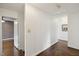 Hallway with hardwood floors and neutral walls showcasing the home's layout at 3317 Harden Rd, Raleigh, NC 27607