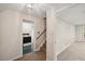 Hallway leading to kitchen with stove and staircase showing the layout at 3317 Harden Rd, Raleigh, NC 27607