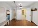Hallway with hardwood floors and doors to other rooms at 3317 Harden Rd, Raleigh, NC 27607
