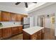 Kitchen with hardwood floors, stainless steel refrigerator and view to other rooms at 3317 Harden Rd, Raleigh, NC 27607