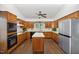 Spacious kitchen with wooden cabinets, stainless steel appliances and center island at 3317 Harden Rd, Raleigh, NC 27607