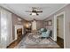 Bright living room with hardwood floors, fireplace, ceiling fan and comfortable seating at 3317 Harden Rd, Raleigh, NC 27607