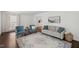 Bright living room featuring hardwood floors, neutral paint, and stylish furniture at 3317 Harden Rd, Raleigh, NC 27607