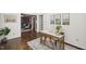 Home office with hardwood floors, natural light and view to other rooms at 3317 Harden Rd, Raleigh, NC 27607