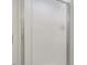 A close up of a white shower door with a metal frame at 3317 Harden Rd, Raleigh, NC 27607