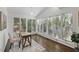 Bright sun room with hardwood floors, large windows and plenty of natural light at 3317 Harden Rd, Raleigh, NC 27607
