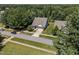 Sprawling aerial view of a home on a large lot, surrounded by mature trees and well-kept lawns at 35 Clubhouse Dr, Youngsville, NC 27596