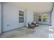 Comfortable back porch with wicker seating, offering a relaxing outdoor space at 35 Clubhouse Dr, Youngsville, NC 27596