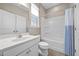 Clean bathroom featuring a combination bathtub and shower with tile flooring at 35 Clubhouse Dr, Youngsville, NC 27596