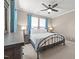 Bedroom featuring a ceiling fan, dresser, and two side tables at 35 Clubhouse Dr, Youngsville, NC 27596