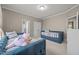 Bedroom with two twin beds, multiple windows and doorway to private toilet at 35 Clubhouse Dr, Youngsville, NC 27596