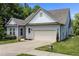 Lovely single-Gathering home with a two-car garage, green lawn, and well-maintained exterior at 35 Clubhouse Dr, Youngsville, NC 27596