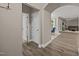 Hallway showcasing the hardwood flooring with views to dining area and living room at 35 Clubhouse Dr, Youngsville, NC 27596