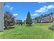 Home's backyard view with green grass and a tree at 3604 Rivermist Dr, Raleigh, NC 27610
