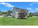 Home's backyard with a tree and a small patio at 3604 Rivermist Dr, Raleigh, NC 27610