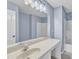 The bathroom offers a white vanity, large mirror, and a shower-tub combo with white tile surround at 3604 Rivermist Dr, Raleigh, NC 27610