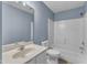 The bathroom offers a white vanity, large mirror, a toilet, and a shower-tub combo with white tile surround at 3604 Rivermist Dr, Raleigh, NC 27610