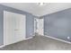 Carpeted bedroom with double closets and white doors at 3604 Rivermist Dr, Raleigh, NC 27610