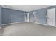 A spacious bedroom features neutral carpet, blue walls, and access to the bathroom and closet at 3604 Rivermist Dr, Raleigh, NC 27610