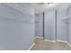 This walk-in closet offers ample storage space with wire shelving and neutral carpet at 3604 Rivermist Dr, Raleigh, NC 27610