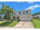 Two-story home with two-car garage and landscaping, showcasing curb appeal on a sunny day at 3604 Rivermist Dr, Raleigh, NC 27610