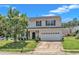 Charming two-story home featuring a two-car garage and landscaped front yard on a sunny day at 3604 Rivermist Dr, Raleigh, NC 27610