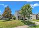 Inviting two-story home with a lush front yard, mature trees, and well-kept landscaping at 3604 Rivermist Dr, Raleigh, NC 27610