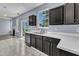 Bright kitchen boasts a double sink, black appliances, and lots of natural light from a large window at 3604 Rivermist Dr, Raleigh, NC 27610