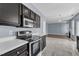 Well-lit kitchen features stainless steel appliances, sleek countertops, and stylish flooring at 3604 Rivermist Dr, Raleigh, NC 27610