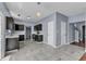 Eat-in kitchen with stainless appliances, marbled floor, and pendant lighting at 3604 Rivermist Dr, Raleigh, NC 27610