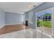 Open-concept living room features a fireplace, and sliding glass doors to the backyard at 3604 Rivermist Dr, Raleigh, NC 27610