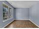 Bright, airy living room featuring wood-look flooring, a large window, and neutral paint color at 3604 Rivermist Dr, Raleigh, NC 27610