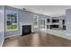 Open layout blends the living room with fireplace into the modern kitchen at 3604 Rivermist Dr, Raleigh, NC 27610