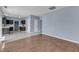 Open layout shows living room with wood-look floors and flows into kitchen at 3604 Rivermist Dr, Raleigh, NC 27610