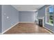 Spacious living room features hardwood floors, a fireplace, and a large window at 3604 Rivermist Dr, Raleigh, NC 27610