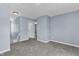 Upstairs landing featuring neutral carpet, and blue paint at 3604 Rivermist Dr, Raleigh, NC 27610