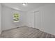 Bright bedroom features a window and large closet at 37 Weeping Willow Ln, Lillington, NC 27546
