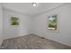 Bedroom with two windows offering outdoor views at 37 Weeping Willow Ln, Lillington, NC 27546